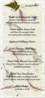 4" x 9" Tea Length Invitation on handmade paper with vellum overlay that is attached by leather fern