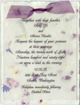 cotton paper invitation with vellum and organza ribbon