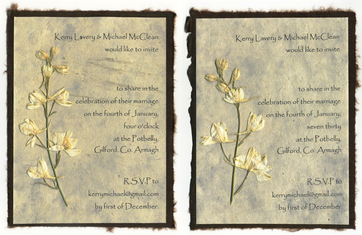 Pressed larkspur invitation with torn edges