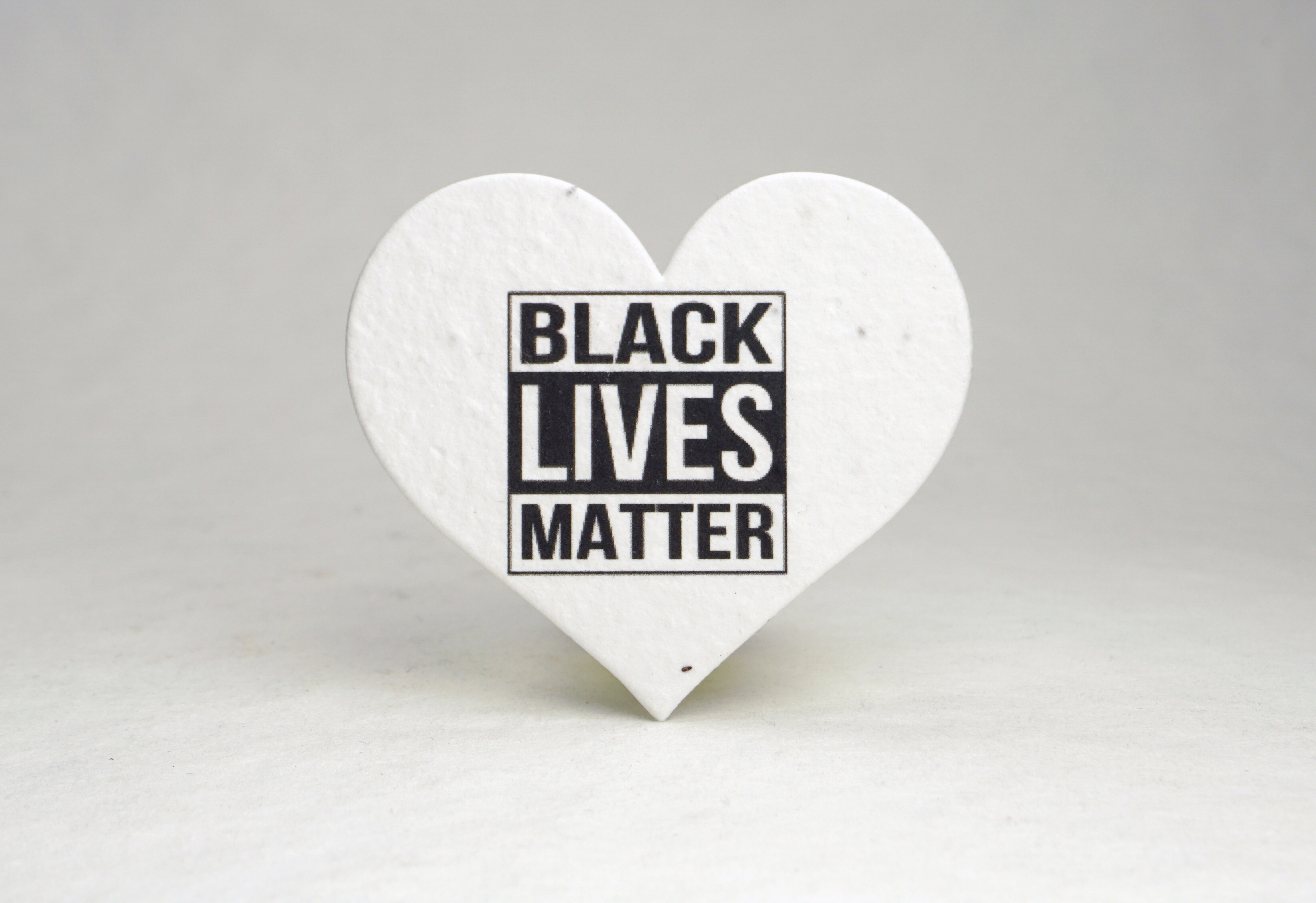 Black Lives Matter message printed on a heart shape embedded with wildflower seeds.