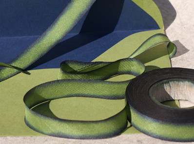 silk ribbon dyed to match a navy and green envelope